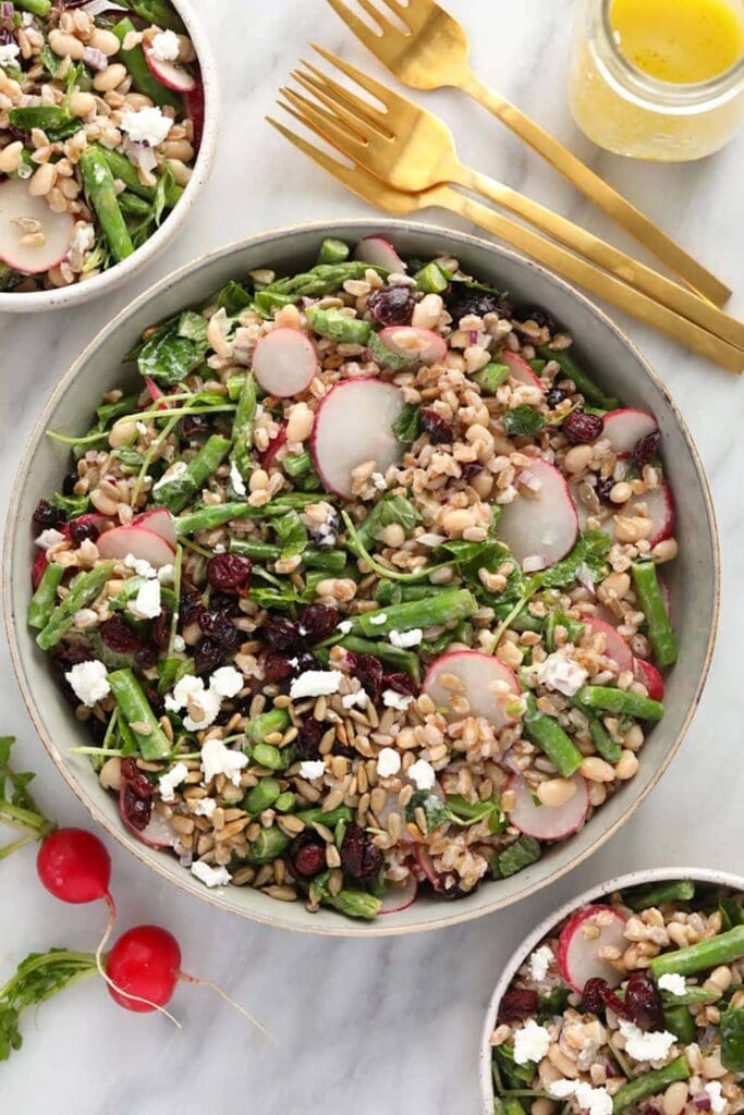 farro salad made with dente farro, blanched asparagus, radishes, microgreens, and goat cheese.