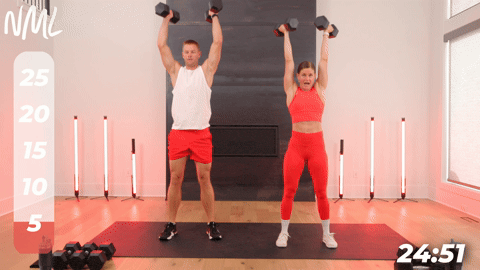 two people demonstrating squat thrusters in a full body shred workout