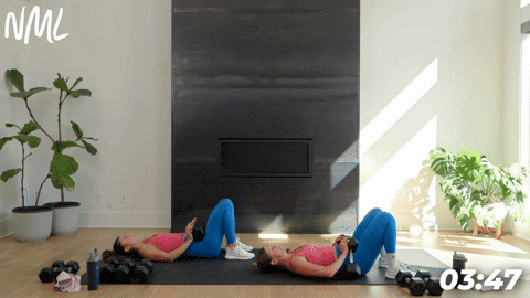 two women demonstrating glute bridges a full body strength circuit workout