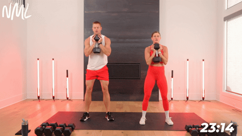 two people demonstrating goblet squats in a full body shred workout