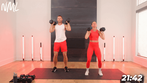 two people demonstrating push presses in a full body shred workout