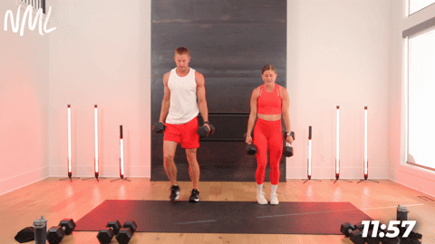 two people demonstrating front lunges in a full body shred workout