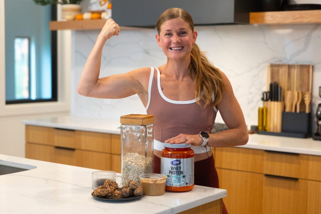 Women in her kitchen with high protein dessert ingredients. 