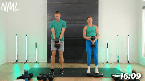 male and female doing a Pivot Cossack lunges as part of a legs and glutes drop set workout.