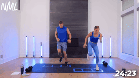 man and woman performing series of double hops and single leg hops as part of agility workout at home