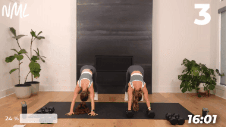women performing a down dog push up flow to return to exercise after sickness