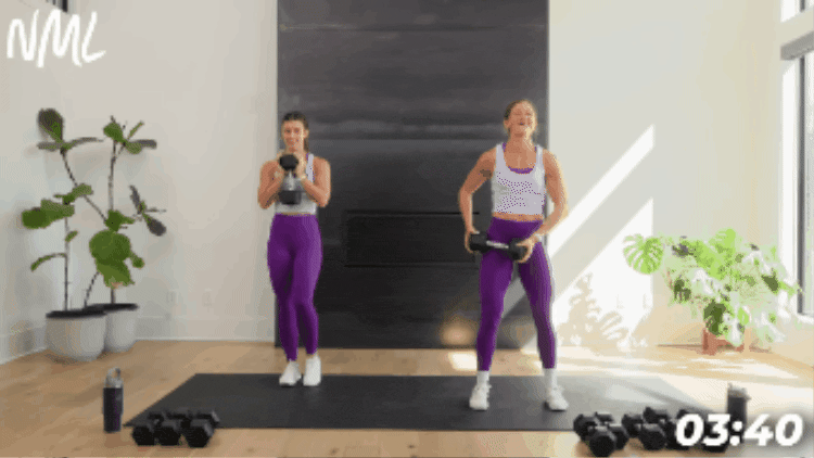 standing dumbbell chop exercise in arms and ab workout