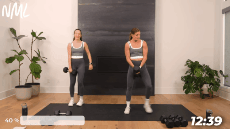 two women performing a lateral lunge as part of sick workout