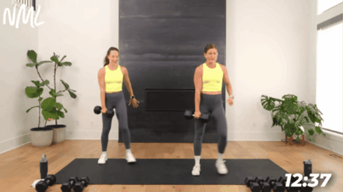2 women performing a lateral lunge as part of quick full body workout at home
