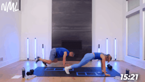 woman and man performing plank sprinters as part of agility workout at home