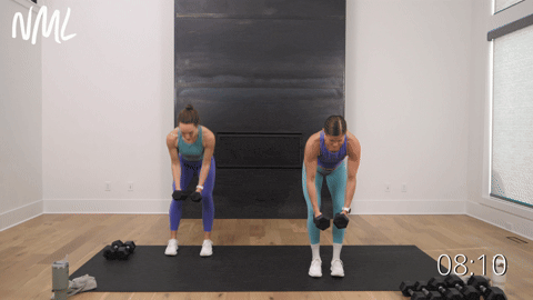 two women performing back flys and straight arm pullbacks with dumbbells in an upper body workout
