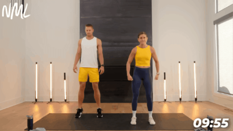 man and woman performing series of calf raises and tib raises to warm up calves