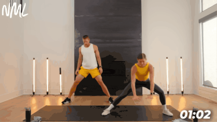 man and woman performing cossack squat to open hips