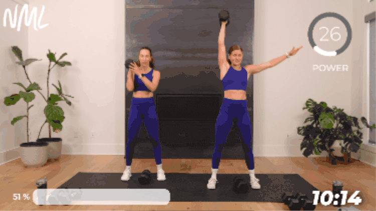 standing women performing a dumbbell snatch as example of lower body power exercise