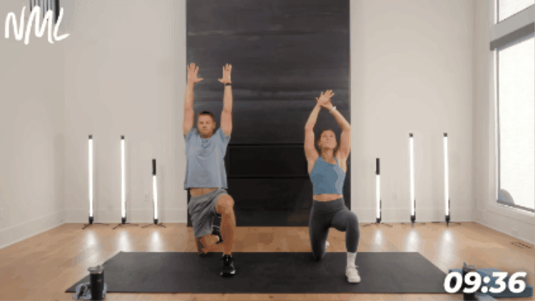 couple performing kneeling hip flexor stretch as part of workout cool-down