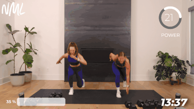 women performing a bodyweight plyo lunge as part of leg superset workout