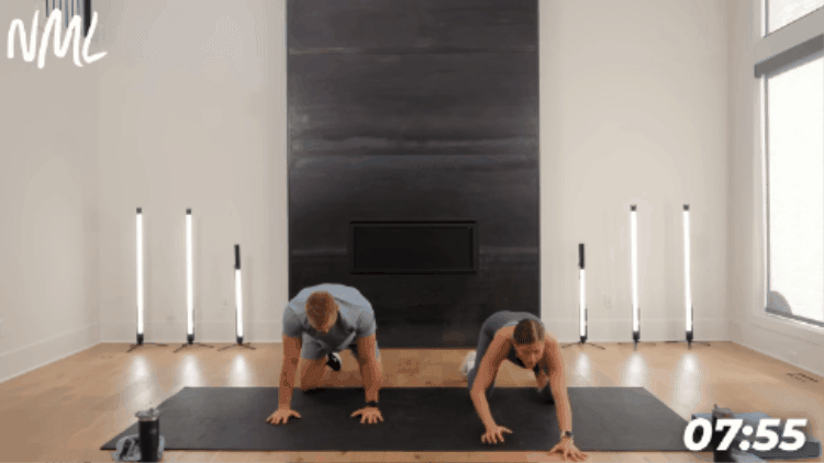 couple performing puppy dog stretch as part of workout cool down stretches routine
