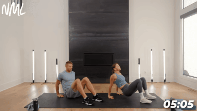 demonstration of reverse table top exercise as part of workout cool down stretches 