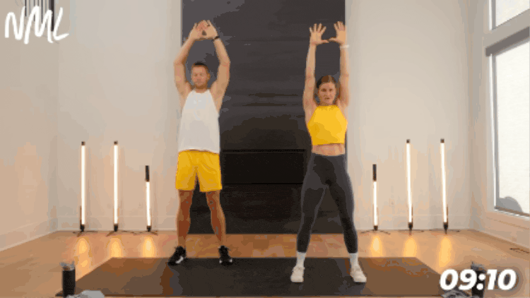 couple performing shoulder warm up exercise as part of dynamic workout warm up