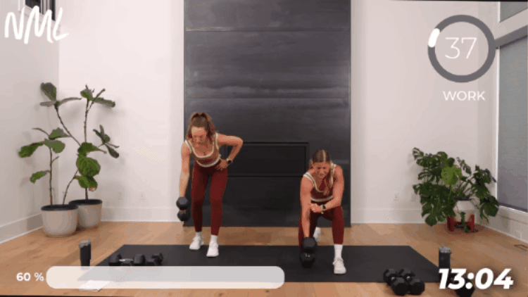 one woman standing and one woman kneeling to perform single arm back row