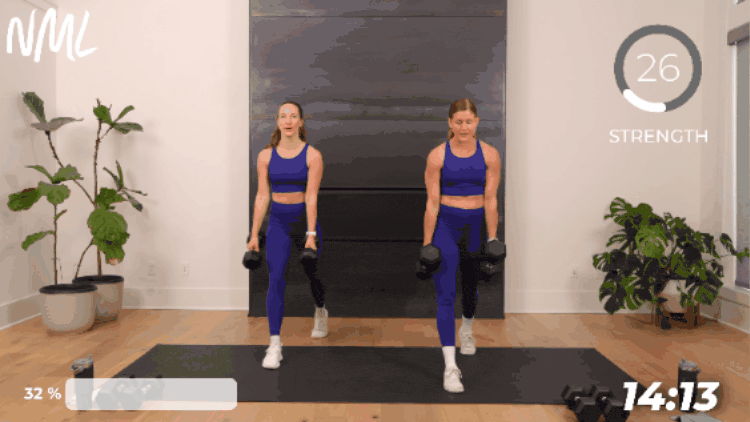 2 women performing dumbbell split lunges as part of superset leg workout routine