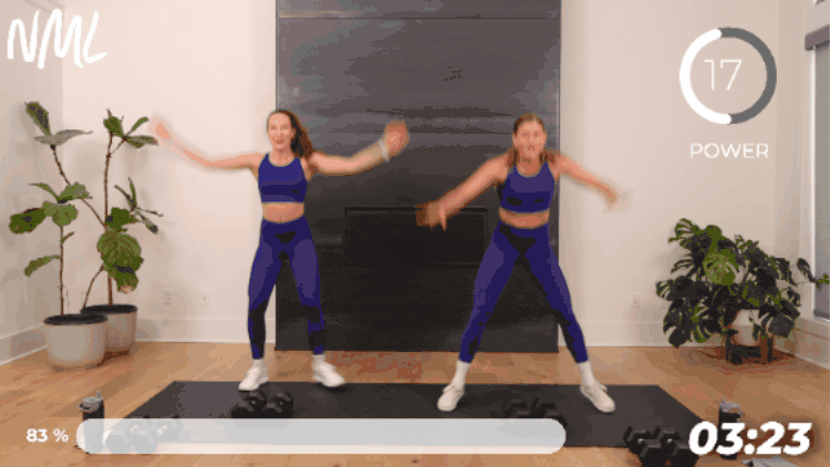 women performing squat jacks as part of leg day superset workout
