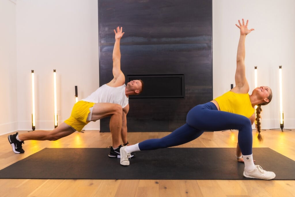 man and woman performing world's greatest stretch as part of full body dynamic warm up
