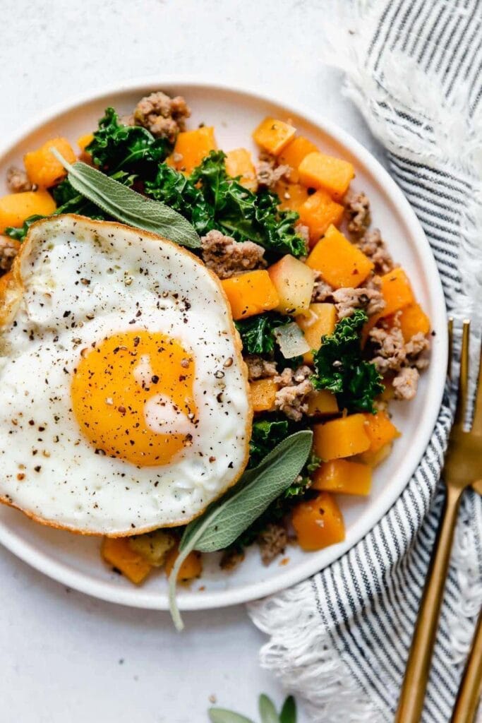 butternut squash and apple hash with sausage as a high fiber breakfast recipes.