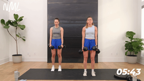 two women performing calf raises as part of a quick leg workout at home