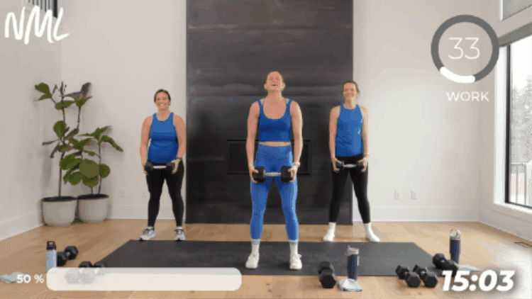 women performing dumbbell front raise as part of beginner weight training workout
