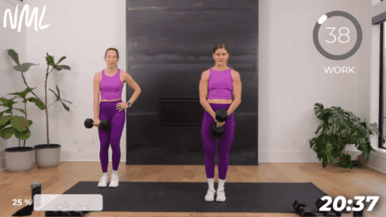 women in purple workout sets performing a lateral lunge as part of full body strength workout