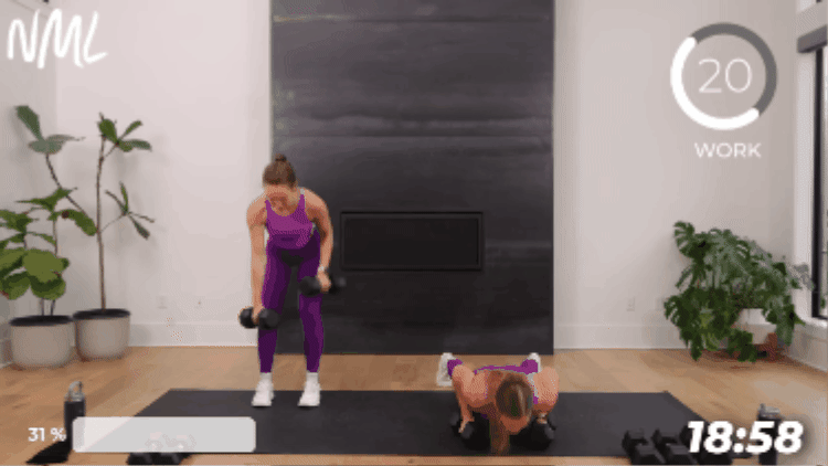 woman performing push up and plank row as part of full body strength workout