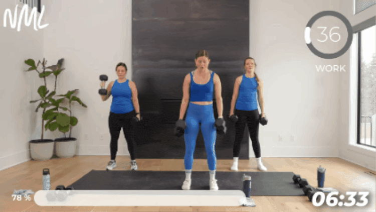 women performing squat, curl and press in beginner weight training workout