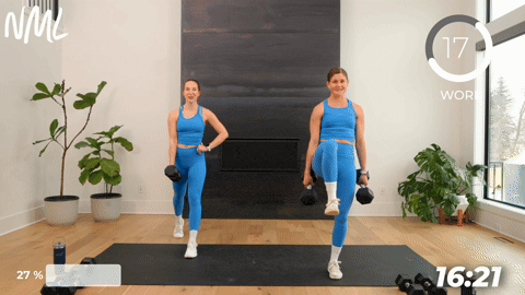 two women performing a dumbbell split lunge in a 20 minute strength workout