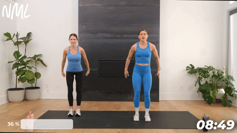 two women performing a calf raise and overhead reach as part of the best lymphatic drainage exercises