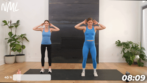 two women performing a good morning and thoracic spine rotation as part of the best lymphatic drainage exercises