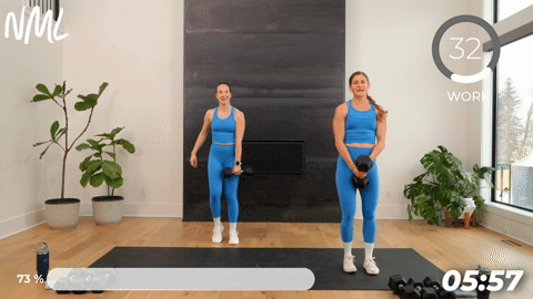 two women performing a dumbbell lateral lunge in a 20 minute strength workout