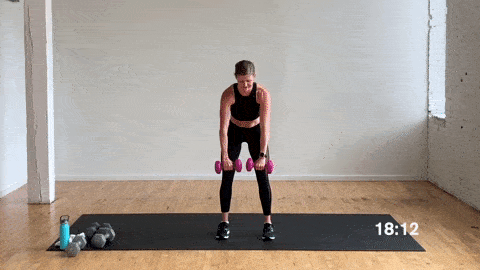 woman doing gorilla rows 