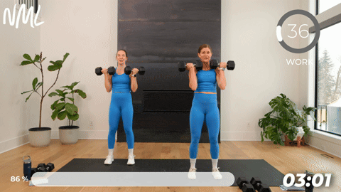 two women performing dumbbell bicep curls in a 20 minute strength workout