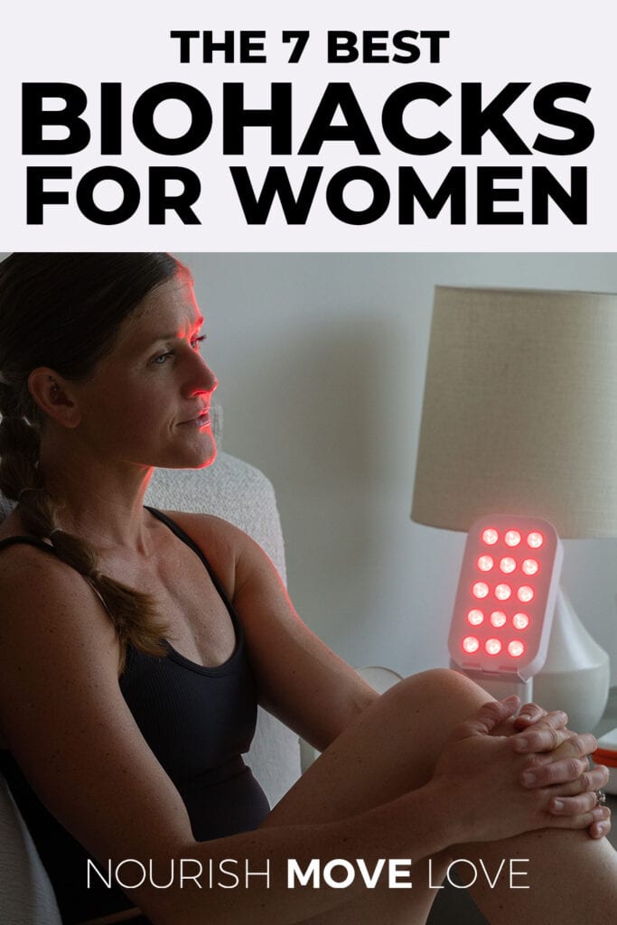woman in front of red light therapy box explaining popular biohacks for women