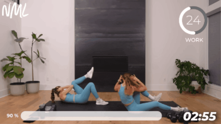 2 women performing bicycle crunches to target outer core muscles