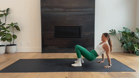 woman performing a bodyweight crab walk as part of the best forearm exercises