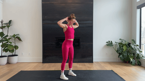 woman performing a bodyweight good morning as part of the best hamstring exercises