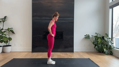 woman performing a pyramid pose as part of the best hamstring exercises