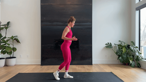 woman performing a bodyweight single leg deadlift as part of the best hamstring exercises