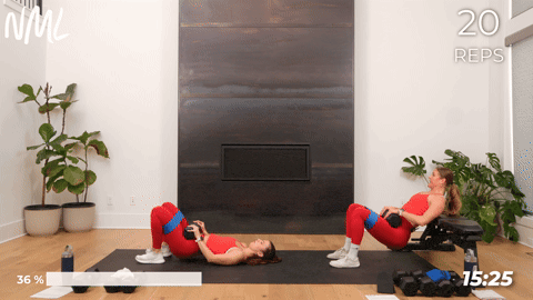 two women performing a banded hip thrust in a lower body workout for women