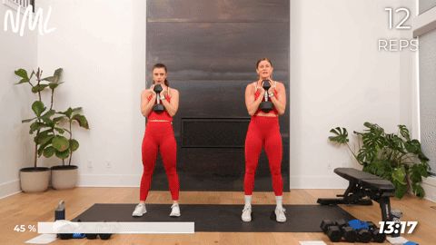 two women performing goblet squats with a dumbbell in a lower body workout for women