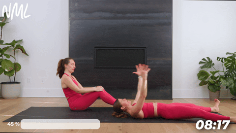 women showing how to perform pilates roll up as part of deep core workout