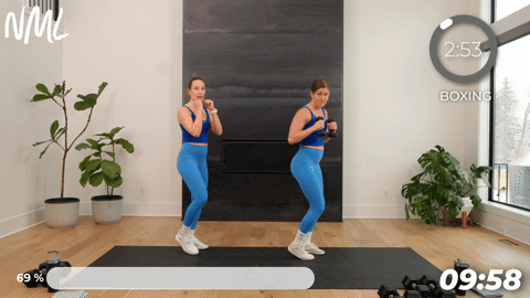 two women performing a jab and cross and hook and uppercut in a boxing workout at home