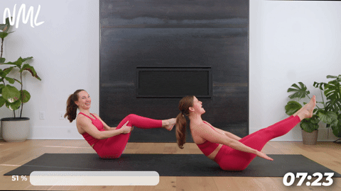 two women demonstrating how to do pilates hundreds from the mat in a pilates workout
